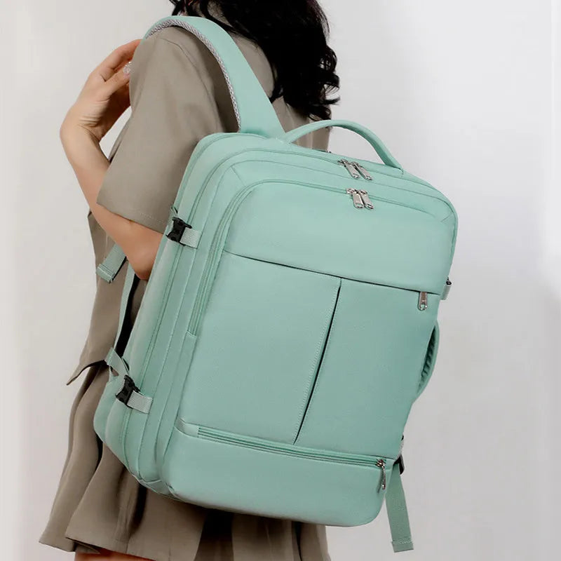 Large waterproof oxford backpack with multiple pockets open to show 15.6-inch laptop compartment