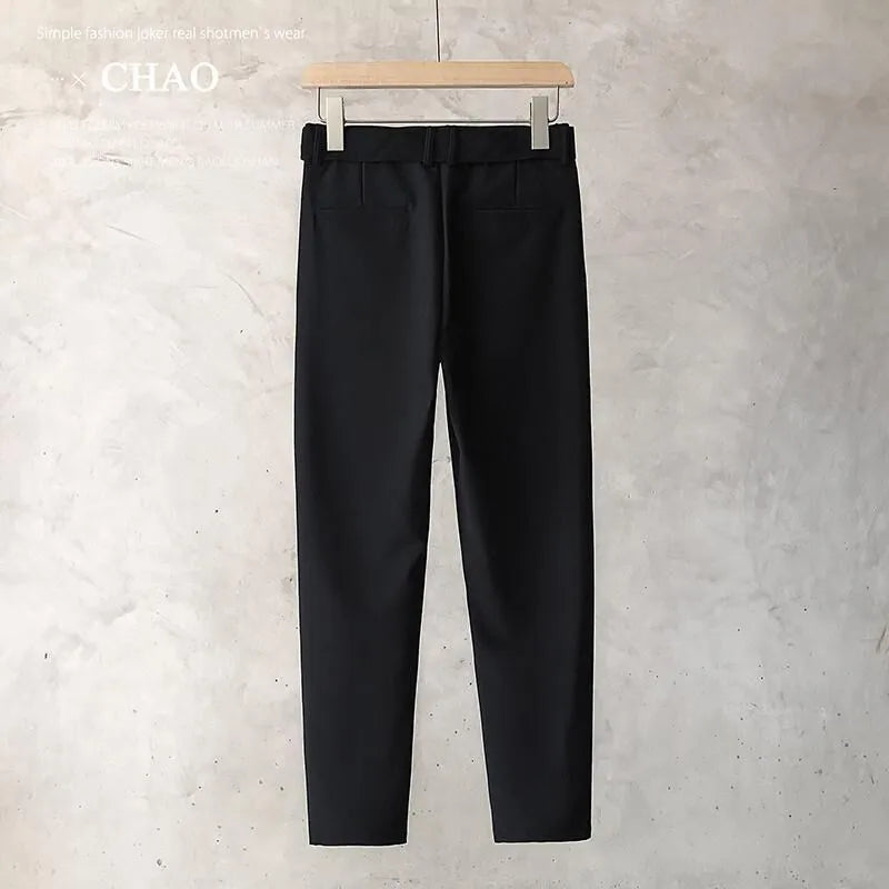 Boy wearing slim straight tapered wool trousers in grey for a business casual outfit.