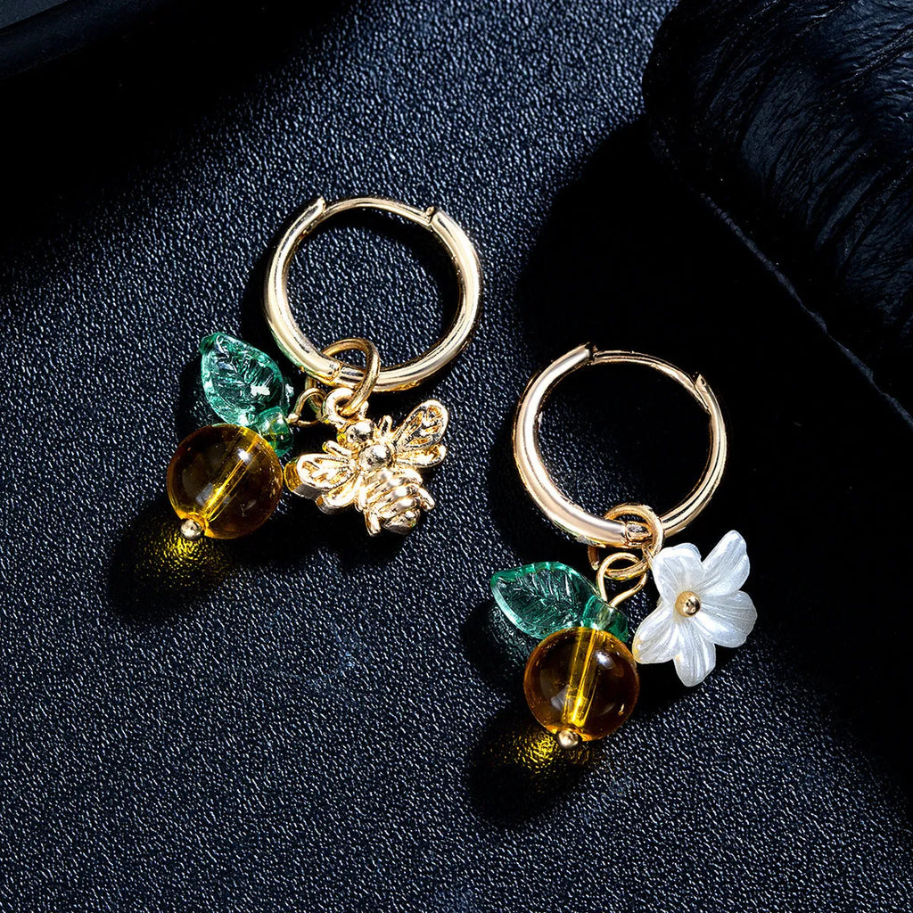 Women's sweet ear cuffs in XY-123 with bee, glass, leaf, and flower pendant details, supplied as one pair.