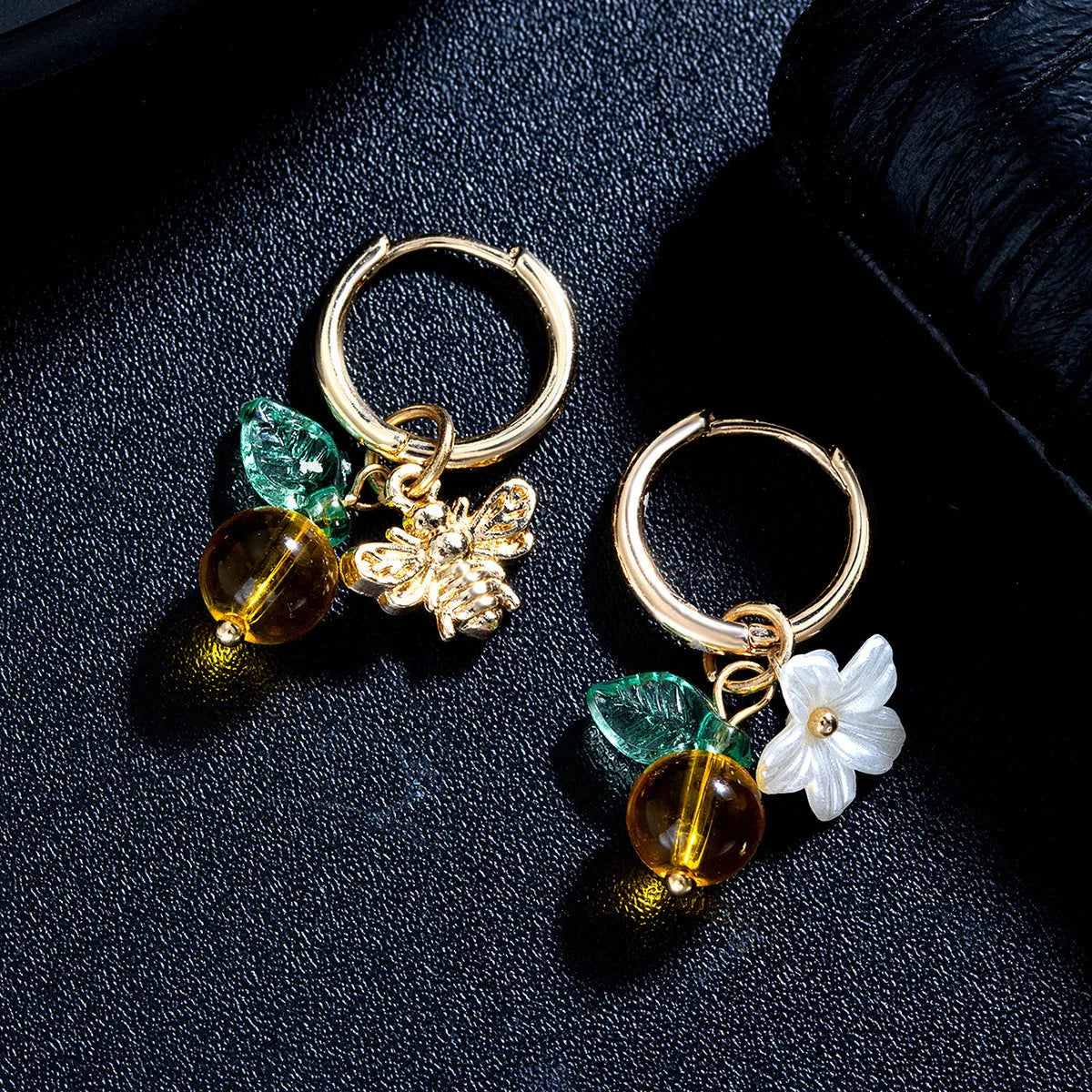 Women's sweet ear cuffs in XY-123 with bee, glass, leaf, and flower pendant details, supplied as one pair.