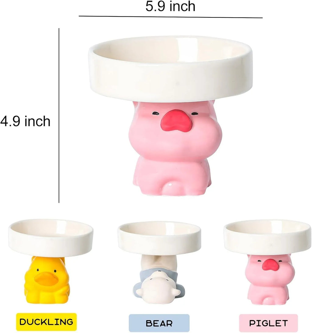 Raised ceramic cat bowl with animal design in pink, yellow, or white, showing wide rim.