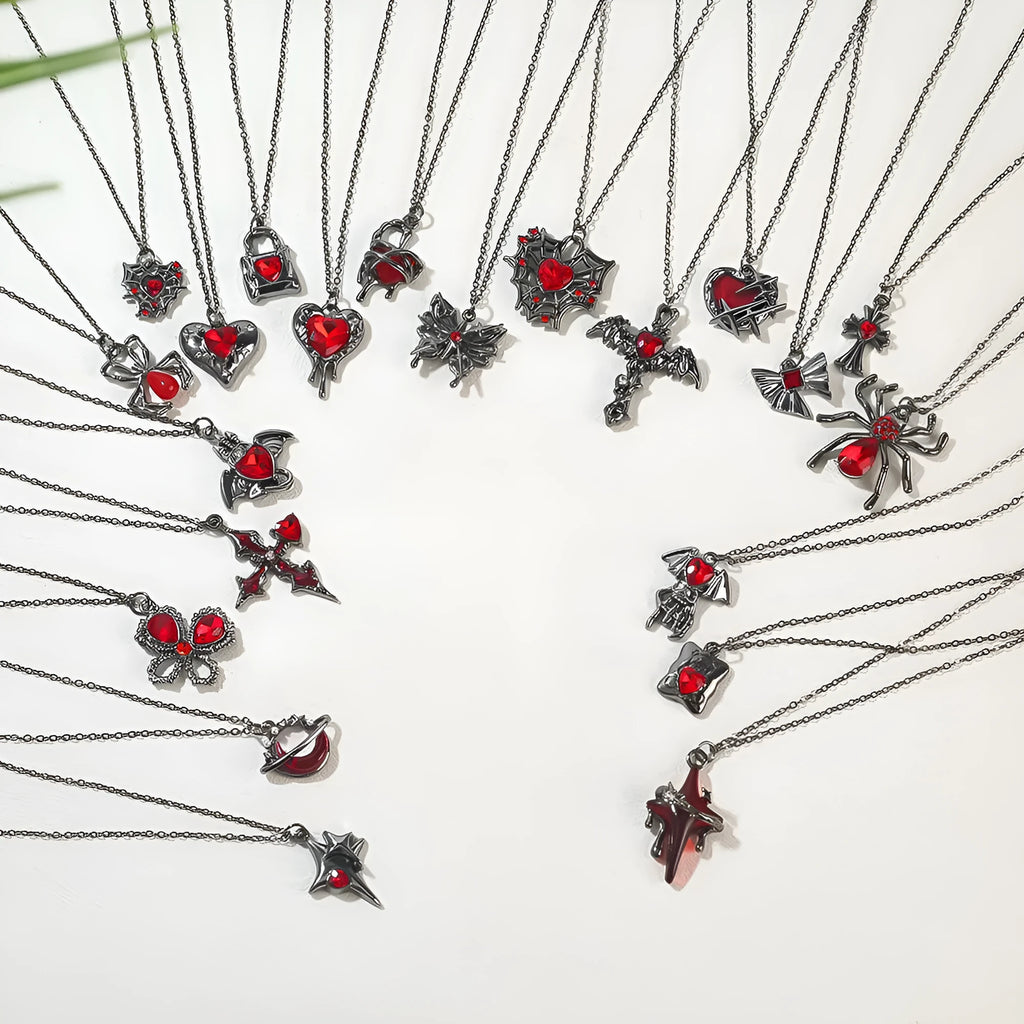 Zinc alloy gothic Halloween necklace showing spider, bat, and cross pendant designs with electroplated finishes