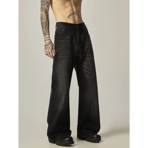 Black loose straight jeans with retro styling and zipper fly on mannequin