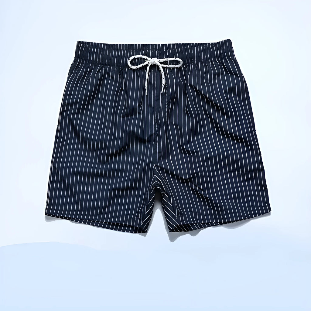 Men's navy blue and grey striped polyester beach shorts with a straight leg cut, laid flat.