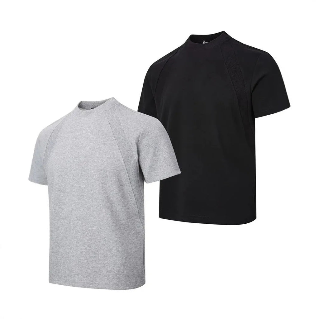 Man wearing a loose-fit black short sleeve top with visible air layer stitching detail.