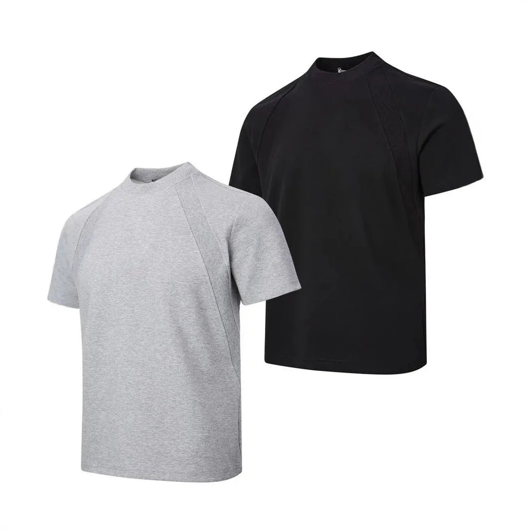 Man wearing a loose-fit black short sleeve top with visible air layer stitching detail.