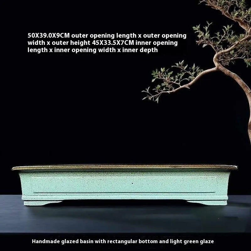 Green handmade ceramic bonsai flower pot with a retro crackled glaze finish.