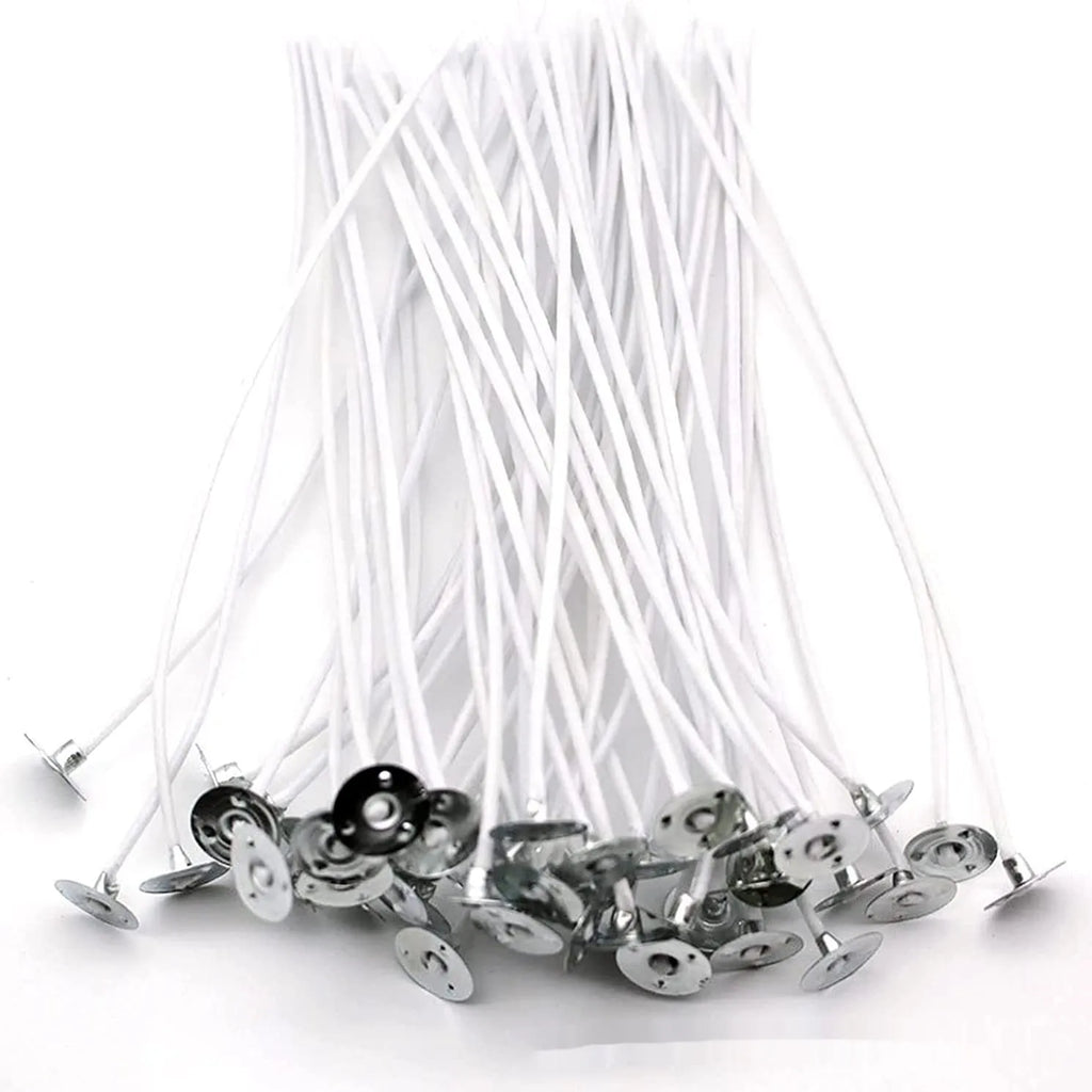 White cotton candle wicks for DIY candle making in three length options on craft background