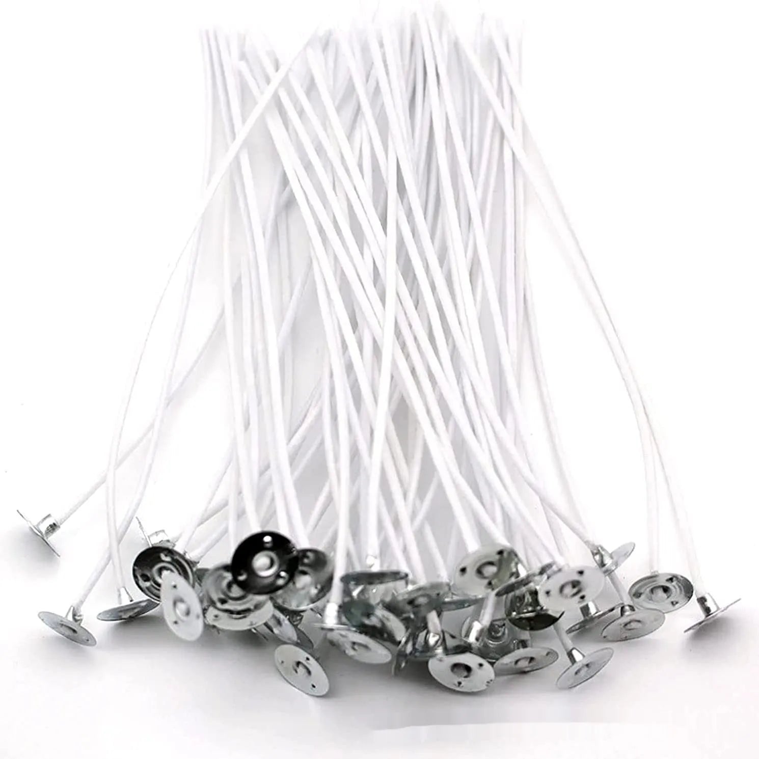 White cotton candle wicks for DIY candle making in three length options on craft background