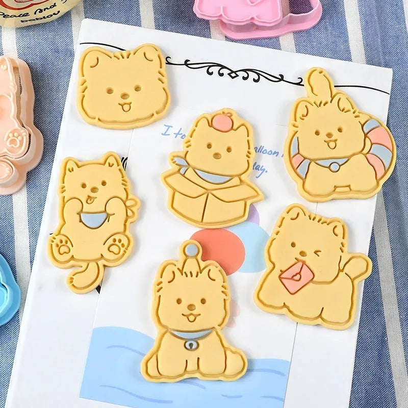 Plastic press mould for making puppy-shaped biscuits and soft candies with cartoon designs.
