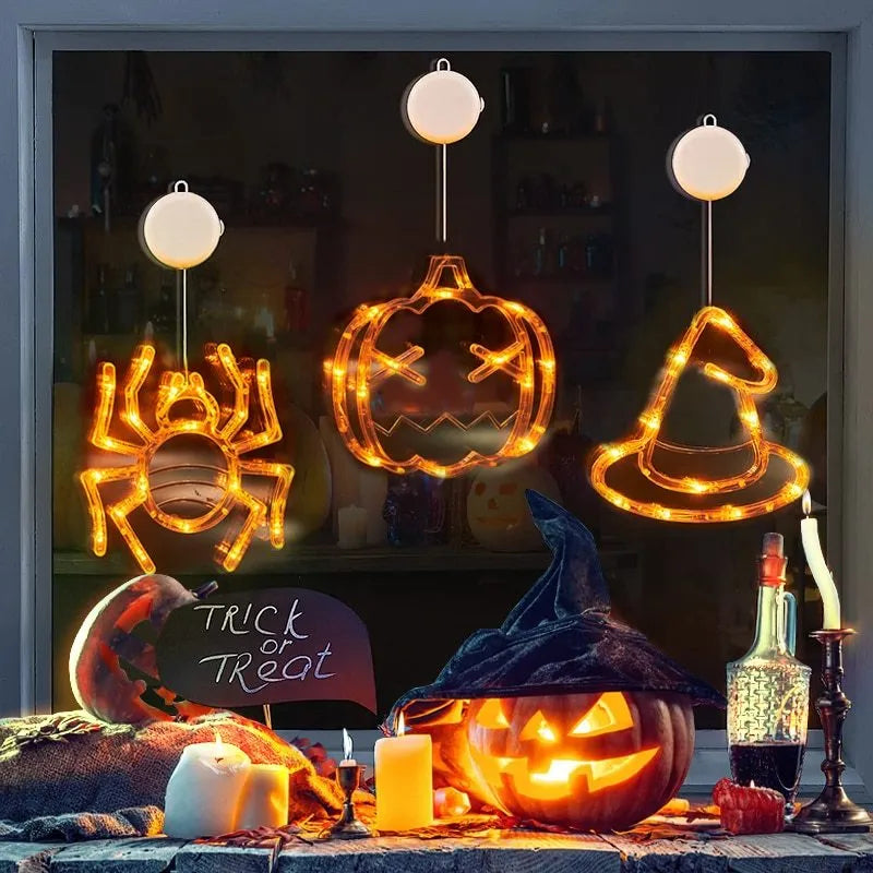 Seven Halloween LED window lights with spider, pumpkin, and ghost designs featuring suction cups for mounting
