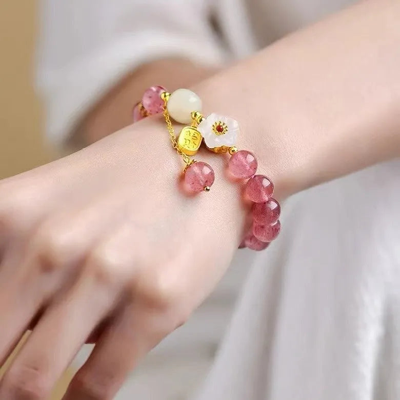 Handcrafted strawberry quartz crystal bracelet with Hetian jade peach blossom charms
