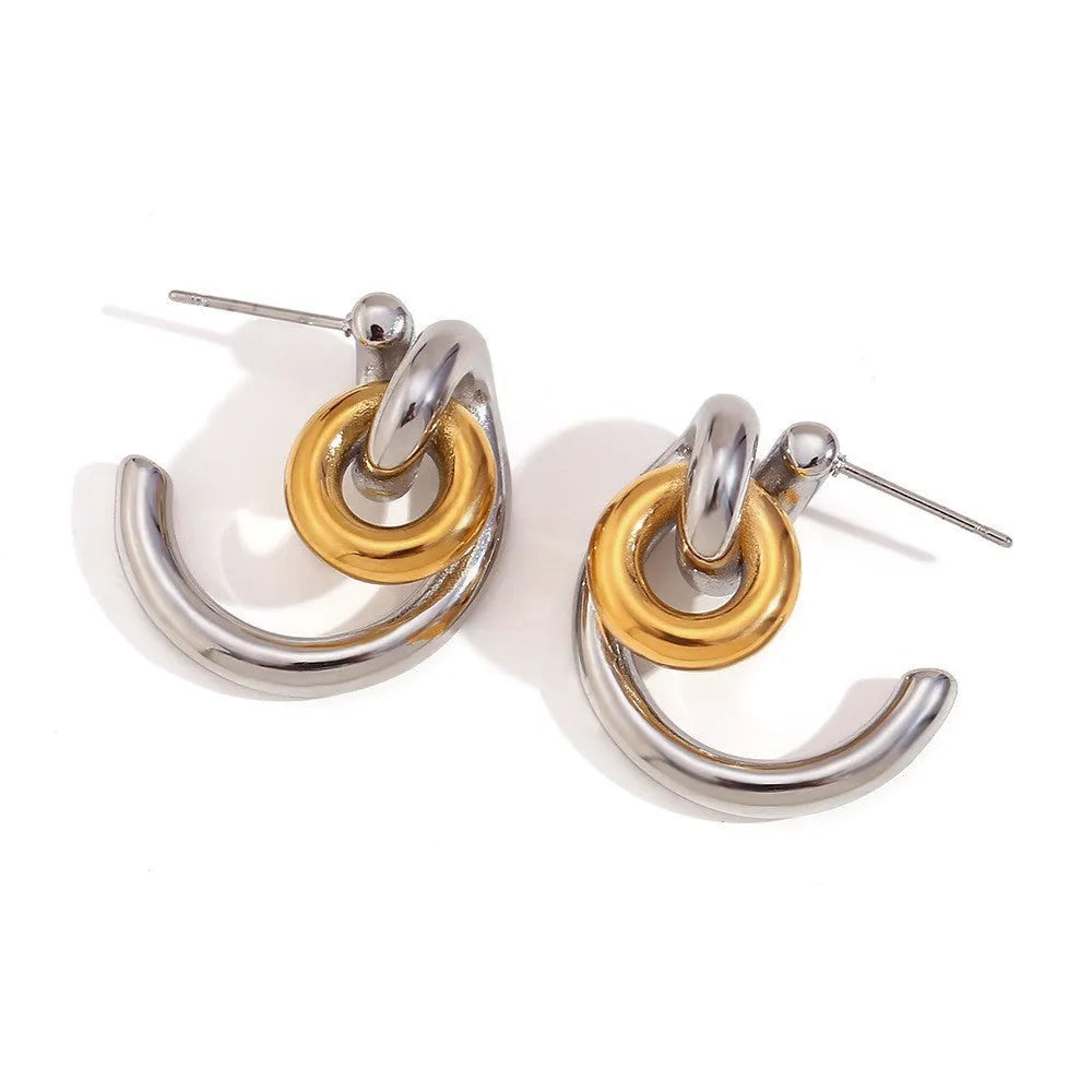 Gold tone electroplated stainless steel jewellery set with geometric shapes including earrings, bracelet and necklace