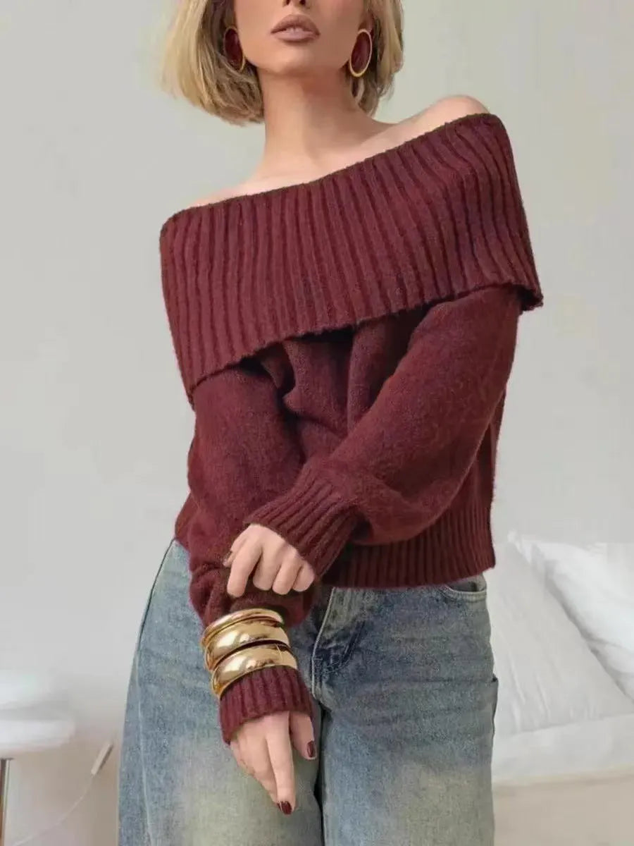 Woman wearing a grey off-the-shoulder sweater with a 3D textured pattern.