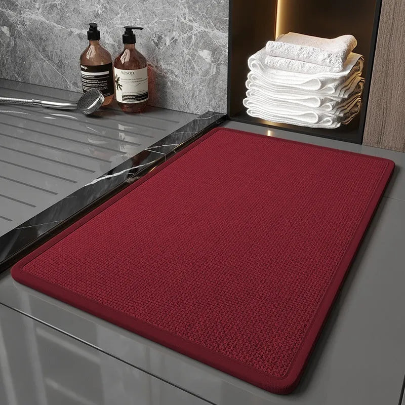 Solid color absorbent anti-slip quick-dry bathroom floor mat in size 40x60cm on a tiled floor