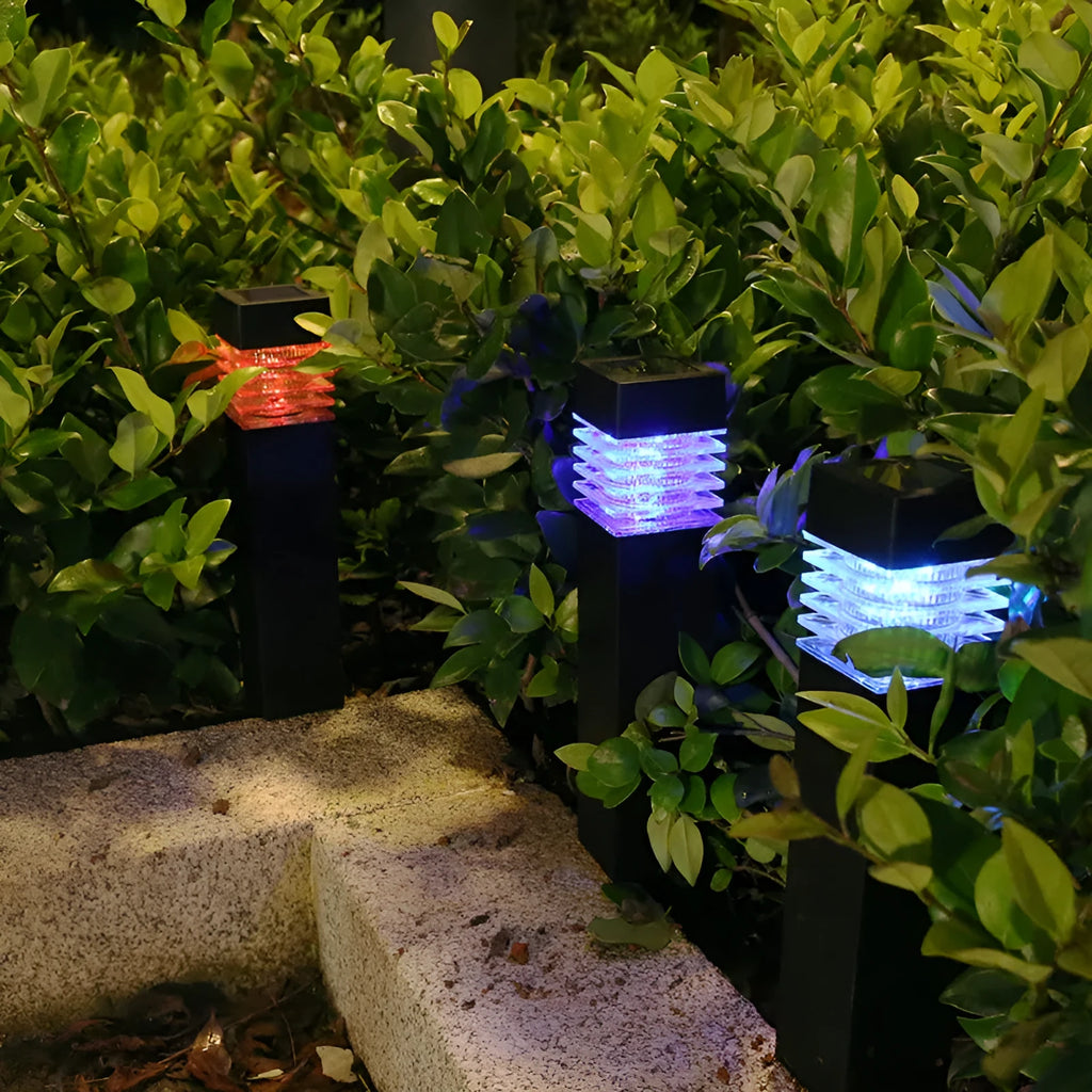 White cuboid solar lawn ground lamp for outdoor garden lighting.