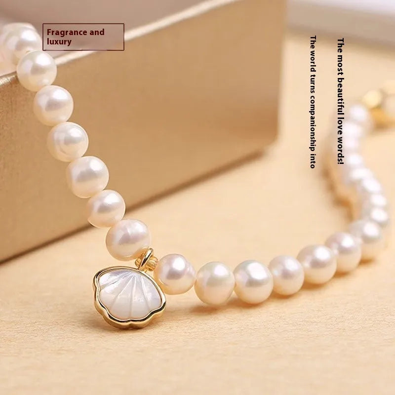 Freshwater pearl bracelet for women showing elastic and chain fastening options with fan-shaped alloy clasp