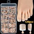 Box of 120 French white edge press-on toenails in nude colours on a full square short shape.