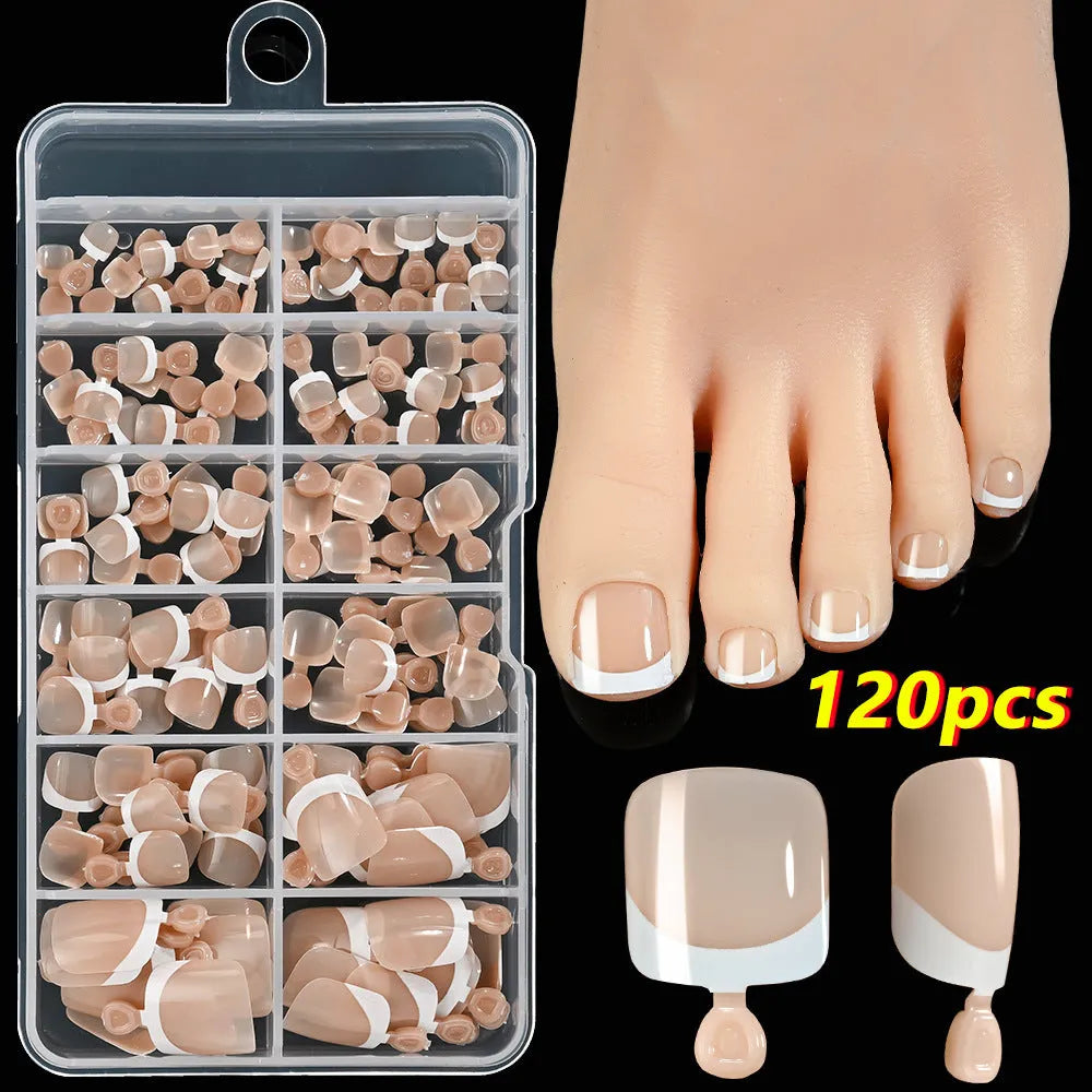 Box of 120 French white edge press-on toenails in nude colours on a full square short shape.