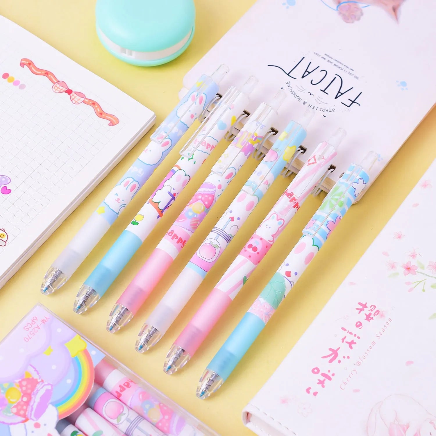Six cartoon bunny decorated black ballpoint pens with 0.5mm tips on a white background.