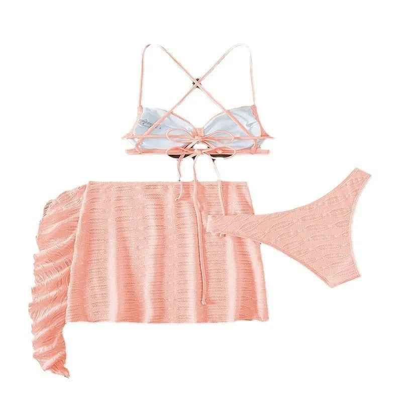 Women's light pink lace-up bikini three-piece set with matching skirt on mannequin