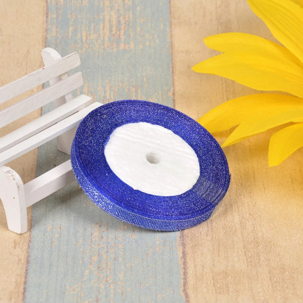 A roll of colourful green onion pattern polyester ribbon with metallic wire highlights, shown at 3-points width.