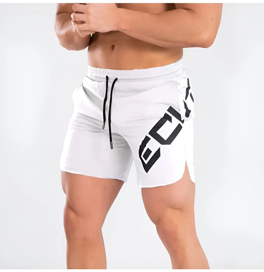 Man's black knee-length elastic waist training shorts made from quick-drying fabric.