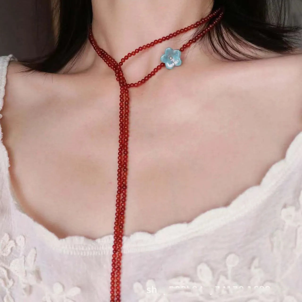 Red agate and acrylic geometric beaded necklace on a woman, adjustable chain 31-40cm