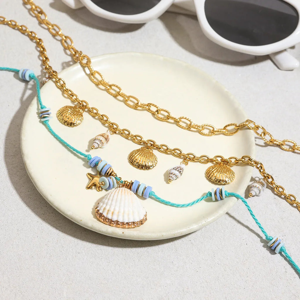 Titanium steel pearl necklace with geometric shell pendant on stainless steel chain