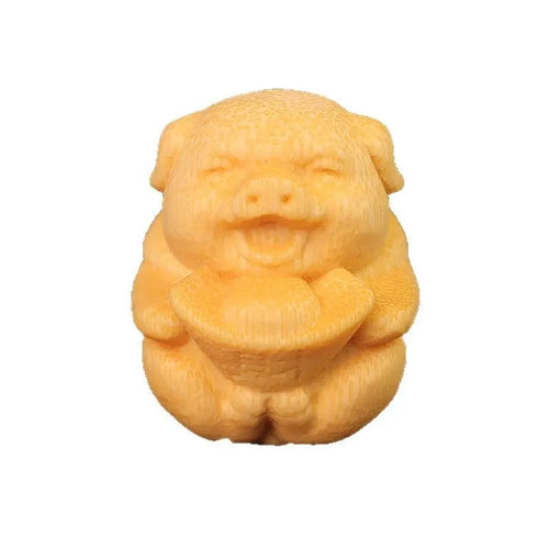 Solid bamboo carving ornament of a cute ingot pig, 4cm tall by 3.5cm diameter.