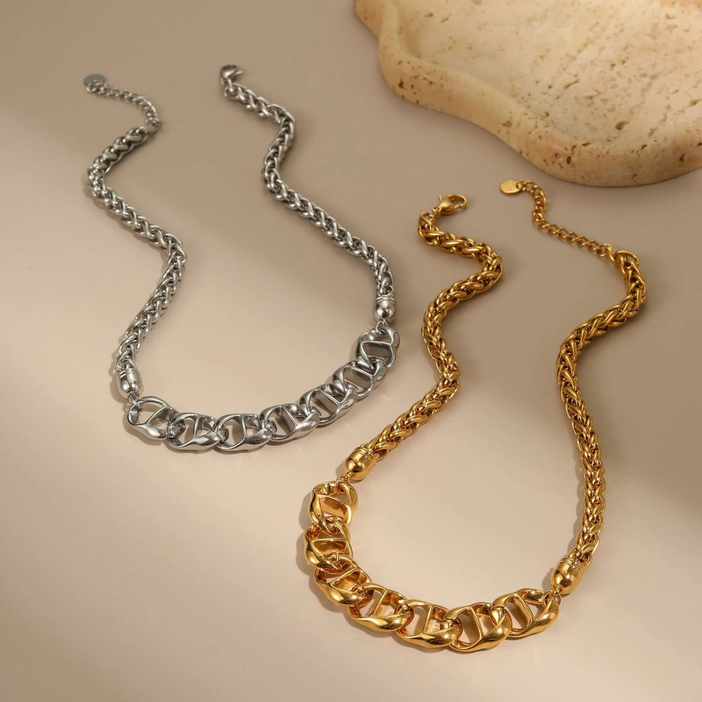 Stainless steel geometric chain necklace with 18K gold plating in gold or steel finish.