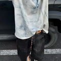 Korean-style solid colour loose fit round neck T-shirt on a hanger, front view.