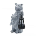 Resin black bear mother and child lantern ornament on a wooden shelf