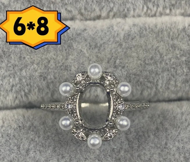 Oval open mouth copper ring with a 6*8 centre stone and five-pointed star ornament detail.