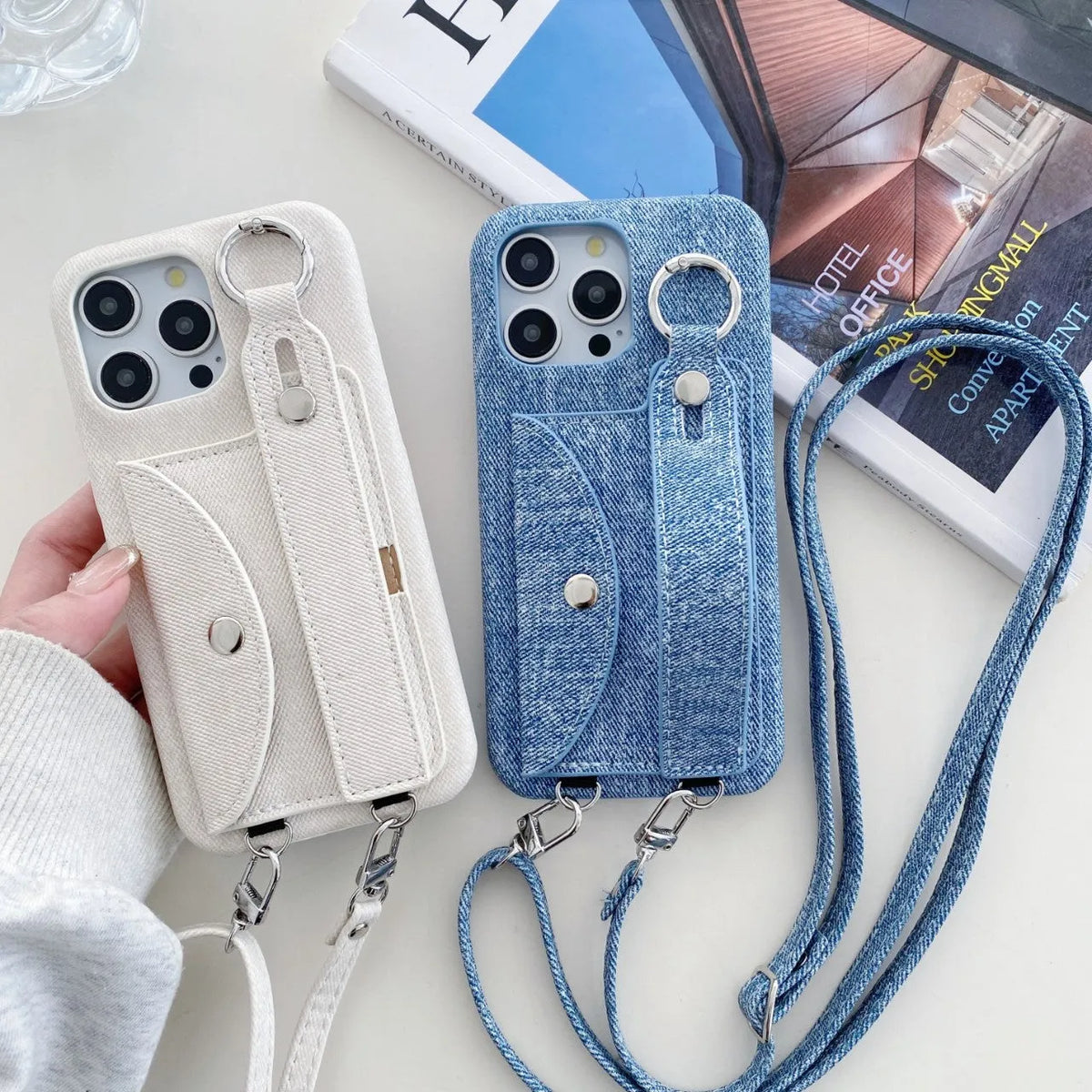 Denim blue leather phone case for iPhone 15 with wrist strap and built-in stand