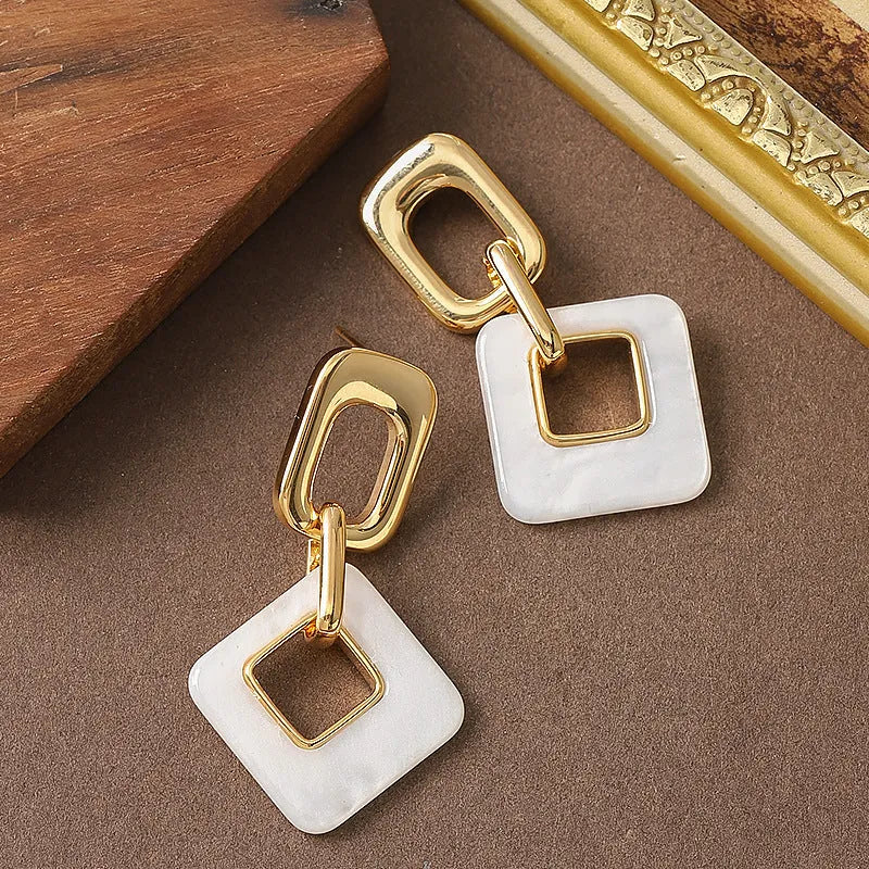 Copper geometric square earrings with hollow construction and chamfered pattern