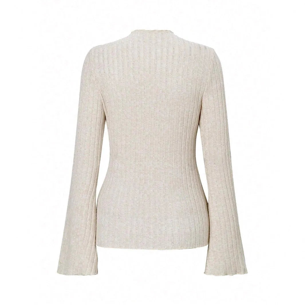 Long sleeve round neck pullover in black with lantern sleeves and a subtle sunken stripe pattern.