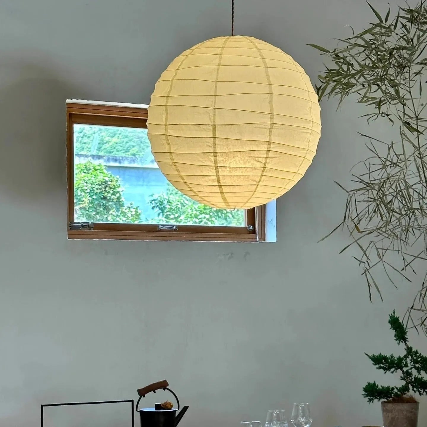 Japanese-style rice paper pendant chandelier in a living room setting.