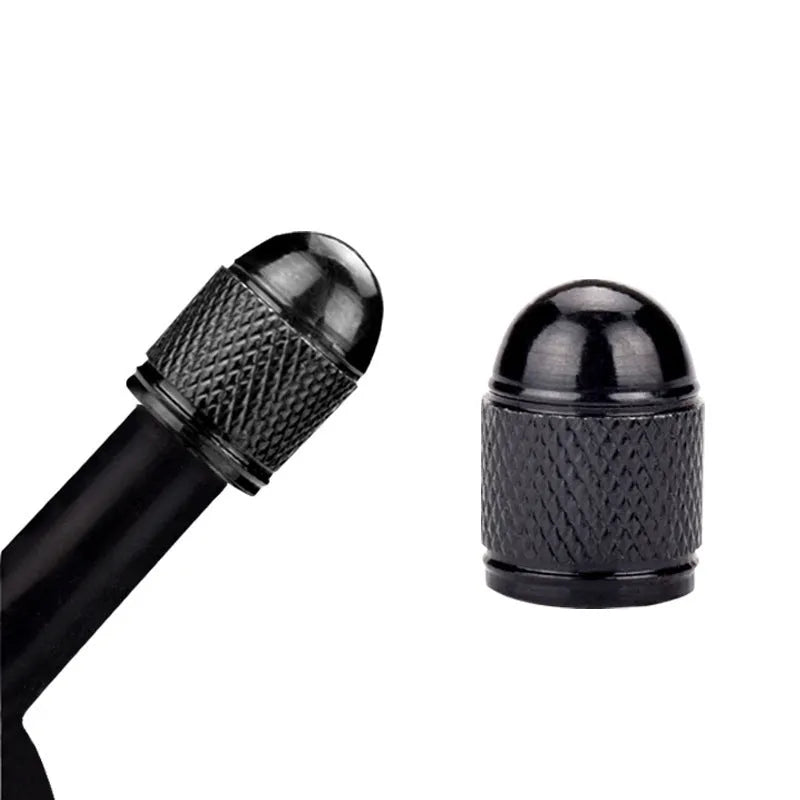 Aluminium mountain bike tyre valve cap in multiple colours on a Schrader valve.