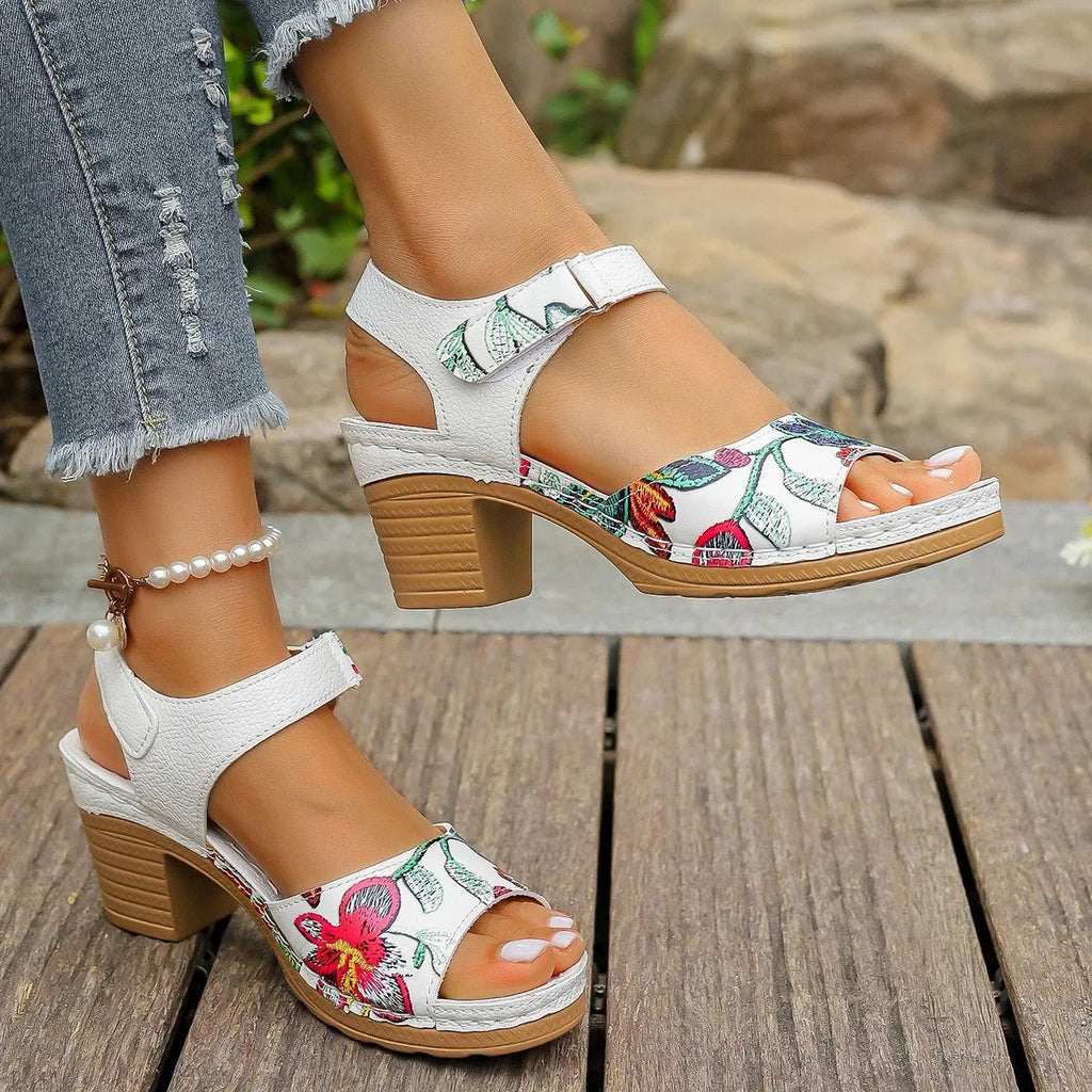 White women's casual sandals with high heel, Velcro buckle straps, and rubber sole.