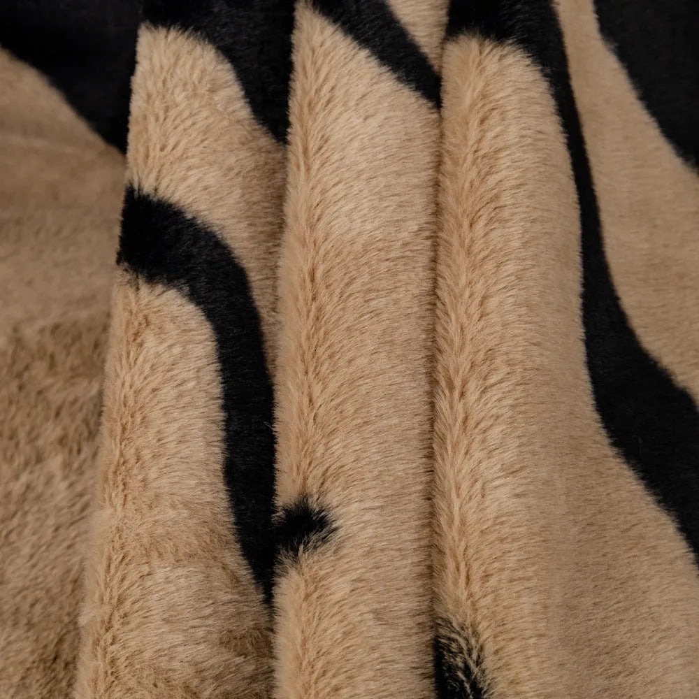 Zebra pattern flannel sofa cover with matching pillowcase in caramel colour on grey sofa