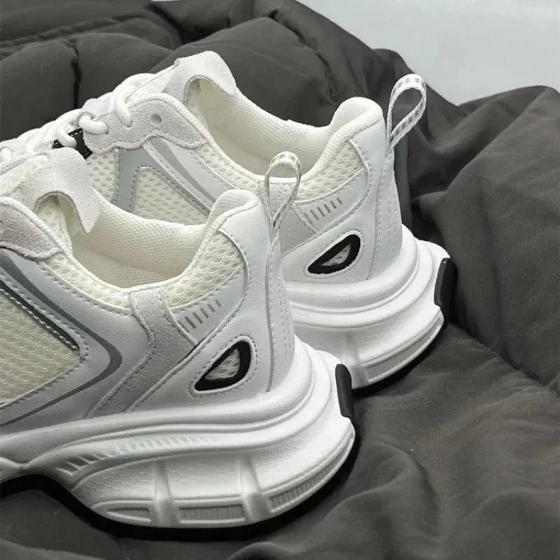 Beige mesh platform sports shoes with a wedge heel and lace-up front.