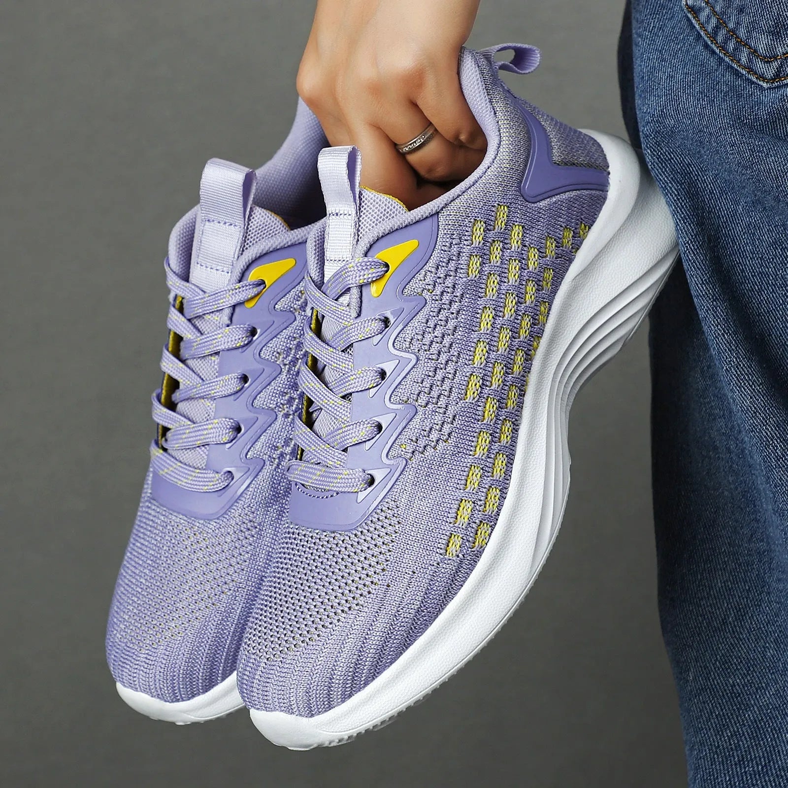 Lavender purple women's Flyknit running shoes with striped pattern and EVA sole.