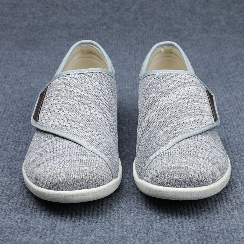 Beige leisure shoes with a Velcro strap closure and a round toe.