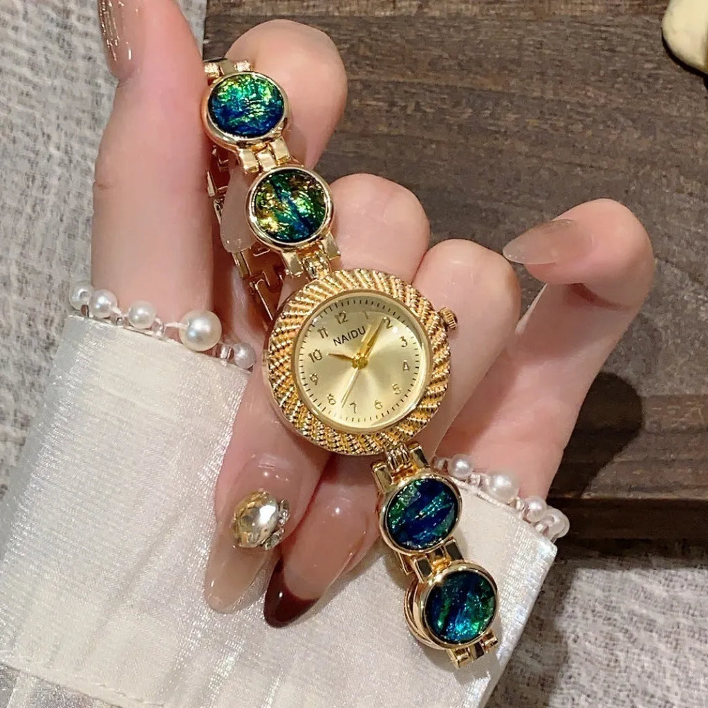 Women's quartz watch with round 25mm dial in one of six colours and zinc alloy case.
