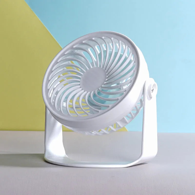Small USB desktop fan in white plastic with three blades, shown as both clip-mounted and floor-standing versions