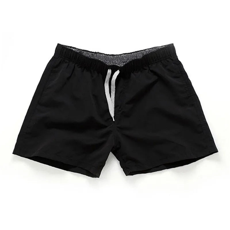 Men's straight-leg polyester beach shorts in multiple colours on a size chart showing S to 4XL.