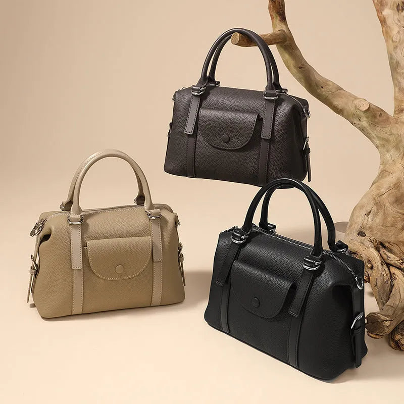 Genuine leather ladies' handbag in black with stitching detail, measuring 27cm wide