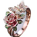 Adjustable fairy style butterfly ring with colourful oil drop centrepiece and leaf design.