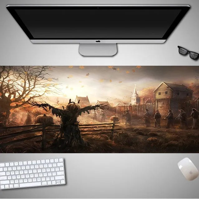 Oversized Halloween-themed gaming mouse pad on a desk, showing anti-slip base and graphic design.